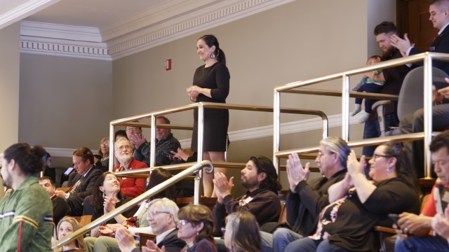 Penobscot Nation Tribal Ambassador Maulian Dana watches the address from the House balcony.