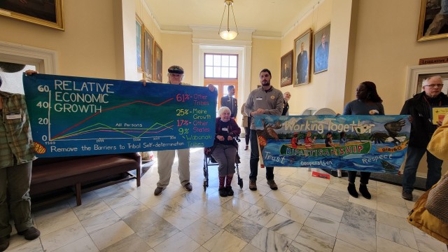 Allies at Lobby Day held banners created by the Artists Rapid Response Team (ARRT!).