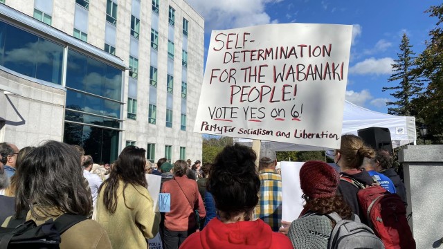 Photo: First Congregational Church UCC, South Portland, ME crowd with person holding sign with text self-determination for the wabanaki people! vote yes on 6! Party for socialism and liberation